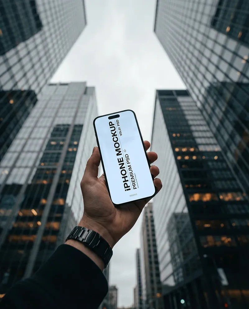Handheld iPhone Mockup in Downtown Skyline